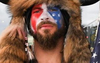 us-capitol-rioter-‘qanon-shaman’-sentenced-to-over-three-years-in-prison