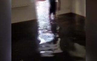 two-days-ago,-flood-waters-had-reached-knee-level-through the-bruce-family’s-home. 