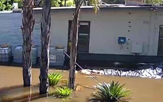 a-home-in-cowirra-floods-after-a-road-was-washed-away.