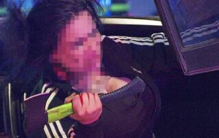 crash-victim-brandishes-axe-as-emergency-staff-try-to-rescue-her-from-rolled-car