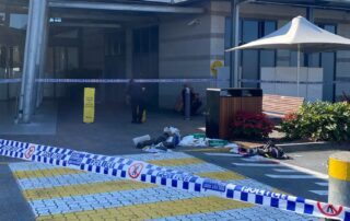 shopping-centre-stabbing-captured-on-cctv,-security-guard-attacked-with-meat-cleaver,-police-allege