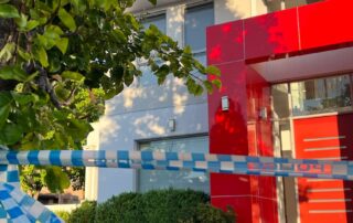 canberra-man-charged-over-wife’s-stabbing-death-makes-brief-appearance-in-court-from-hospital-bed