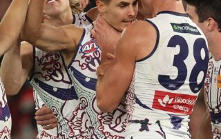 dockers-keep-touch-with-top-eight-with-win-over-saints,-lions-enjoy-record-breaking-win-over-tigers