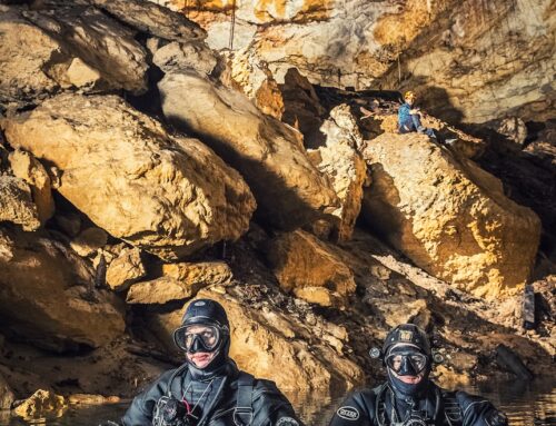 Divers dig a new entrance to an ancient 30-metre-deep cave just metres from a rural road