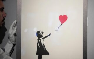 two-men-charged-over-theft-of-banksy’s-girl-with-balloon-painting